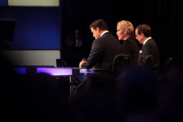 Bret Baier, Megyn Kelly and Chris Wallace speaking at the final Republican Party debate, hosted by Fox News, before the 2016 Iowa caucuses at the Iowa Events Center in Des Moines, Iowa.