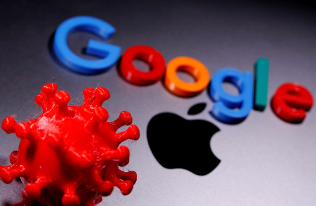 3D printed coronavirus model and Google logo are placed near an Apple Macbook Pro in this illustration taken April 12, 2020.